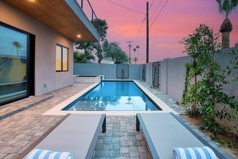 Luxurious Scottsdale vacation home with a private pool, outdoor lounging area, and scenic sunset view in Old Town Osborn.