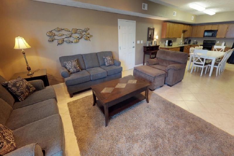 Myrtle Beach Villas - 305B Interior view of Myrtle Beach Villas 305B, a 4-bedroom luxury condo with living room, dining area, and open kitchen.