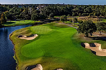 Aerial view of Barefoot Fazio golf course in South Carolina, featuring lush green fairways, sand bunkers, and water hazards.