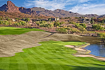 Scenic view of Eagle Mountain Golf Course in Phoenix, Arizona, with lush green fairways, desert landscape, and mountains in the background.