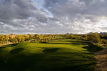 Scenic view of Grayhawk Talon Golf Course in Scottsdale, featuring lush greens under a dramatic sky in the Sonoran Desert.