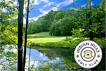 Lush green golf course with a pond and trees at Indian Hills Golf Club in Ontario, featuring the club's emblem.