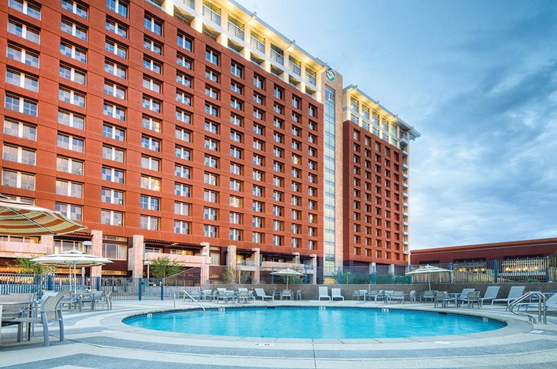 Luxury Talking Stick Resort & Casino in Scottsdale with a pool, high-rise hotel, and desert views, offering golf, dining, and entertainment.