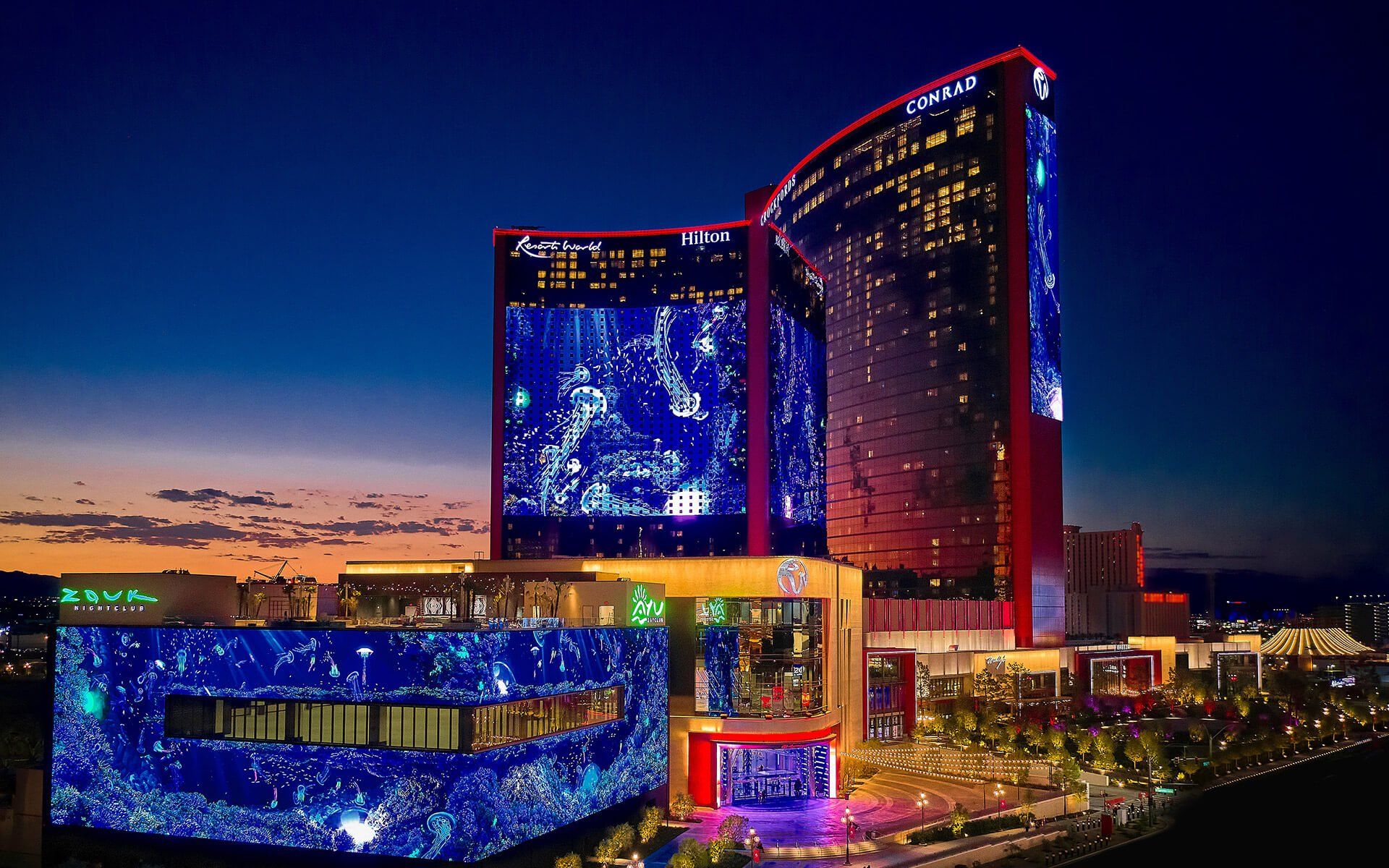 Las Vegas Hilton at Resorts World Night view of the Las Vegas Hilton at Resorts World with illuminated digital displays on the building's facade.
