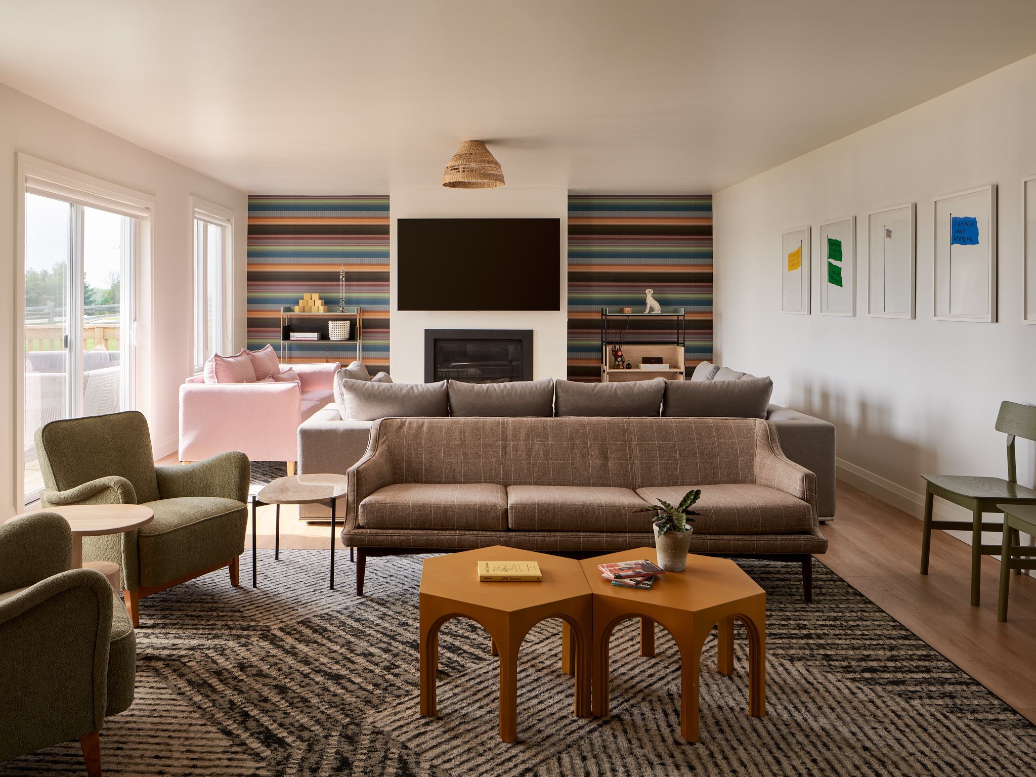 Rental Homes at Black Bear Ridge Luxurious living room at Black Bear Ridge with modern furniture, colorful wall accents, and large windows overlooking the outdoors.
