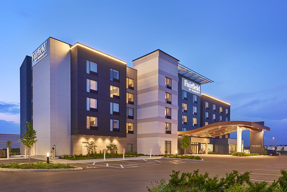Fairfield by Marriott Belleville Modern Fairfield by Marriott Belleville hotel building at dusk with illuminated signage and a spacious parking lot.