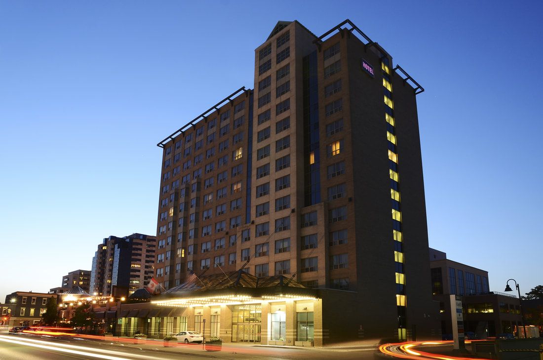 The Park Hotel The Park Hotel, a tall modern hotel building in downtown London, illuminated at dusk with lit windows and a lit entrance.