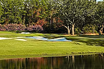 Scenic view of the Azalea Course at Lakewood Golf Club, featuring rolling fairways, sand bunkers, lush trees, and a water hazard.