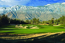 Golf course with sand bunkers, lush green fairways, and mountain backdrop at Marriott's Shadow Ridge Golf Club.