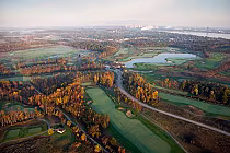 Aerial view of Usshers Creek Golf Course with lush green fairways, water hazards, and colorful autumn trees, part of Legends on the Niagara.