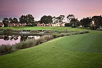 Sunset over Orange Lake Golf's 18-hole course with lush greens, water hazards, and scenic natural surroundings in Florida.