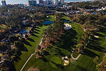 Aerial view of Pine Lakes Golf Club in Myrtle Beach, featuring lush green fairways, sand bunkers, water hazards, and tall trees.