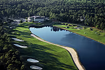 Aerial view of Prestwick Country Club golf course with a large water hazard, sand bunkers, lush green fairways, and surrounding trees.