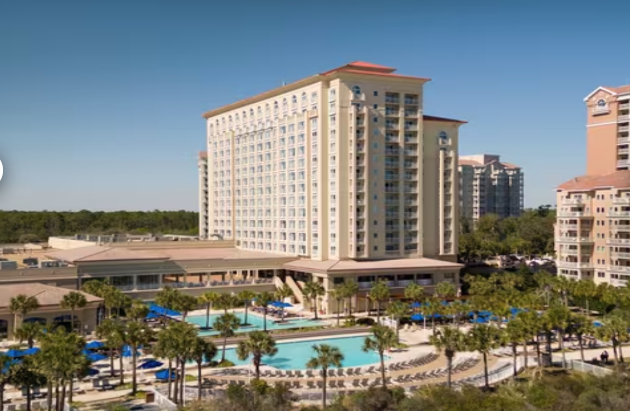 Marriott Myrtle Beach Resort & Spa at Grande Dunes Marriott Myrtle Beach Resort & Spa at Grande Dunes, oceanfront hotel with a large pool, surrounded by palm trees, in Myrtle Beach, SC.