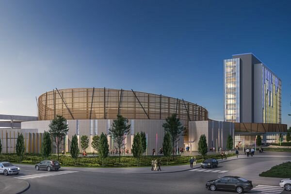 Pickering Casino Resort Modern Pickering Casino Resort with a unique circular design, surrounded by trees, parking, and a tall glass hotel tower.