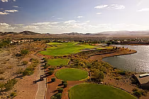 Aerial view of Revere Golf Club Concord Course with lush green fairways, water hazards, and desert landscape in Las Vegas.