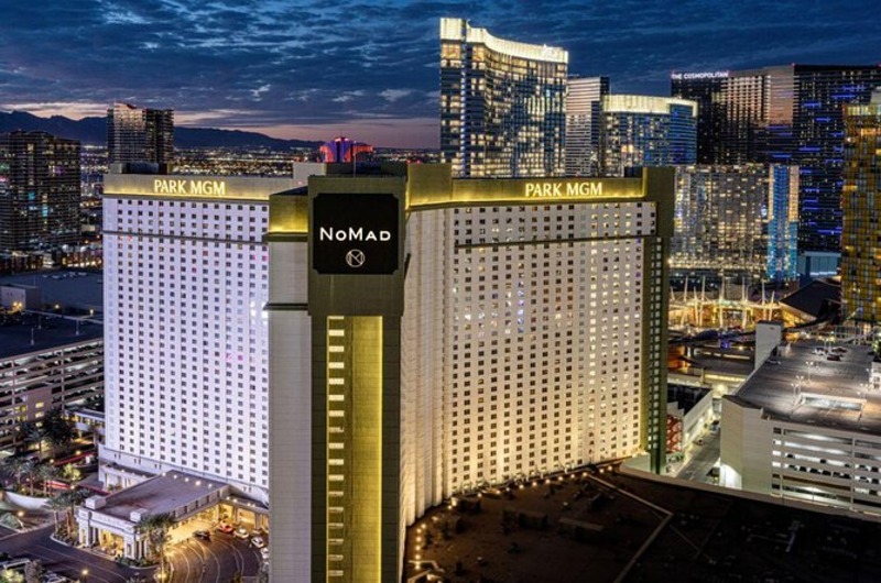 Park MGM Night view of the illuminated Park MGM hotel on the Las Vegas Strip with city skyscrapers in the background.