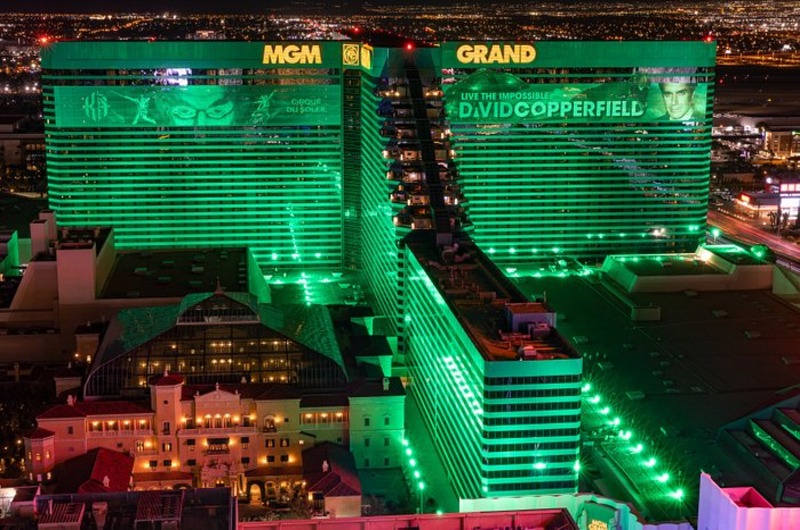 MGM Grand Hotel and Casino Night view of the MGM Grand Hotel & Casino in Las Vegas illuminated with green lights, showcasing its large size and vibrant atmosphere.