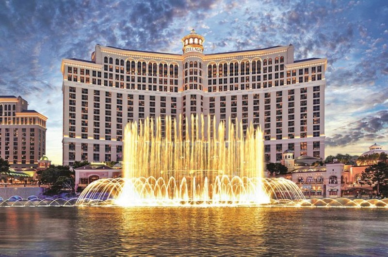 Bellagio Hotel & Casino Bellagio Hotel & Casino with illuminated fountain display in front, European-inspired architecture, at dusk.