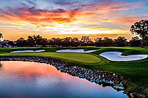 Beautiful sunset over Arnold Palmer's Championship Course at Bay Hill with lush greens, sand bunkers, and water hazards.