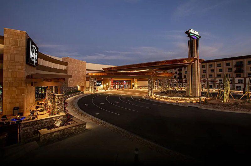 Luxury resort entrance at We-Ko-Pa Casino Resort in Phoenix/Scottsdale, AZ, with modern architecture and a curved driveway at dusk.